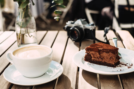 Coffee, chocolate cake and an analog camera photo