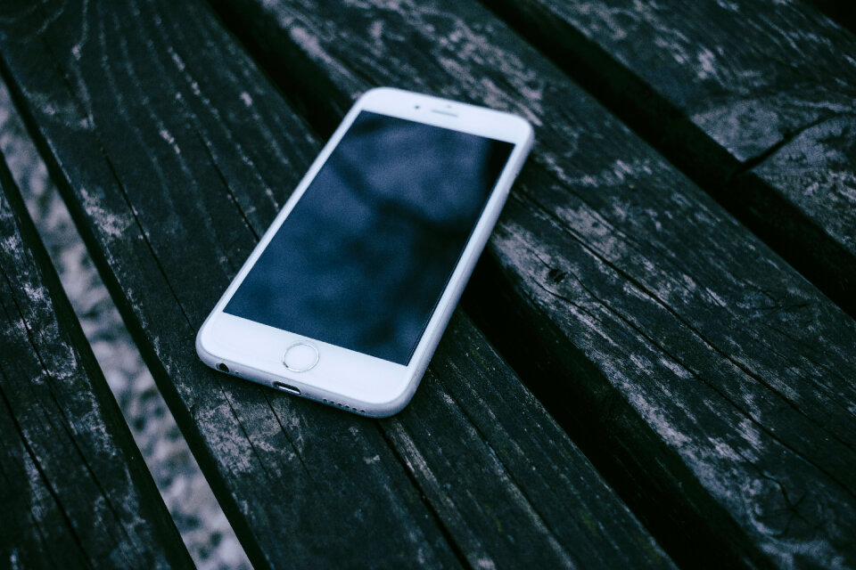 iPhone on a wooden bench