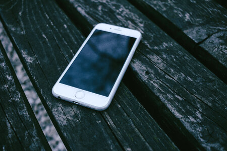 iPhone on a wooden bench