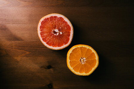 Grapefruit and orange cut in half photo