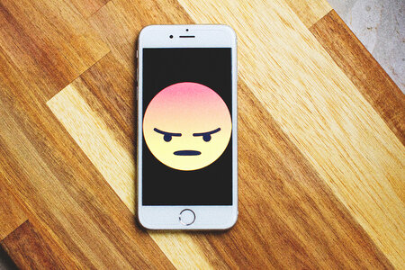 Angry face emoticon on iPhone photo