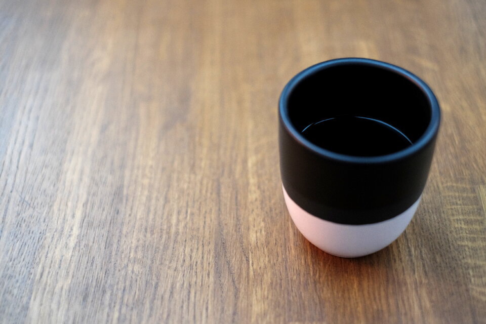 Mug of coffee on a wooden table photo