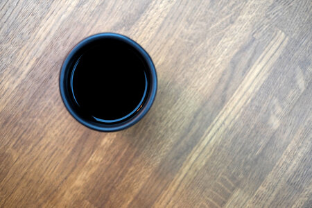 Mug of coffee on a wooden table 2 photo