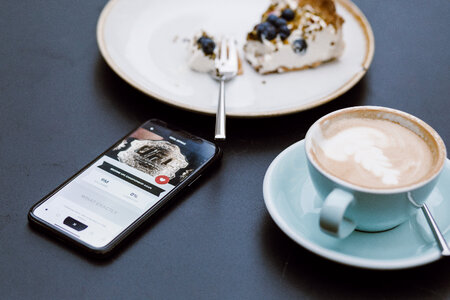 iPhone X on the table in a café photo