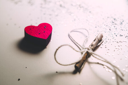 Tiny letter and a wooden heart photo