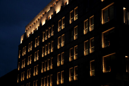Modern building windows at night photo