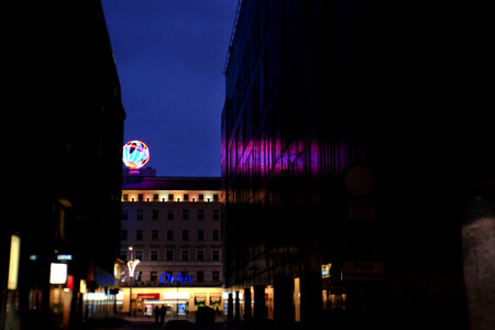 Illuminated led globe in the city at night photo