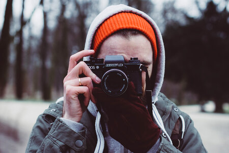 Man shooting with an analog camera photo