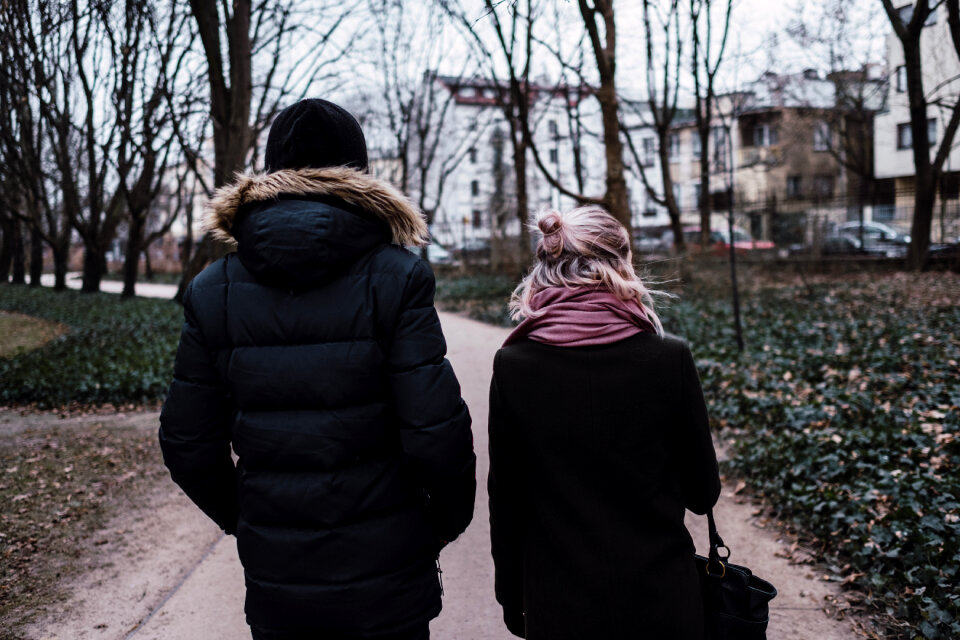 Two people walking in the park