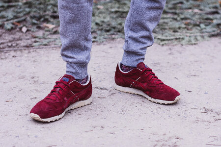 Male feet in red snickers