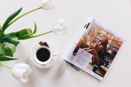 Tulips, cup of coffee and a magazine photo