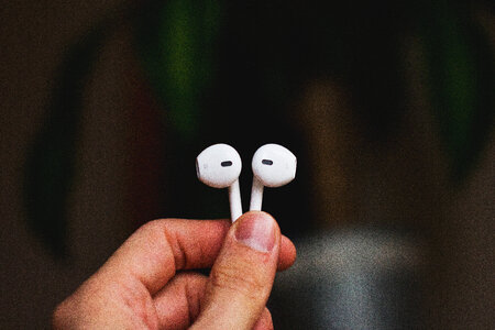 iPhone headphones in a male hand 2
