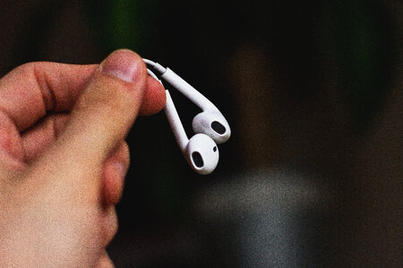 iPhone headphones in a male hand photo