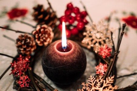 Christmas wreath and a round candle photo