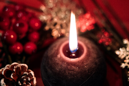 Christmas wreath and a round candle closeup 2 photo