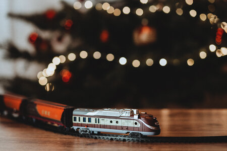 Toy train going around the Christmas tree photo