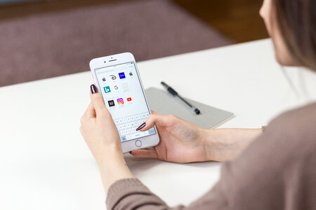 Female holding an iPhone 8 Plus 2 photo