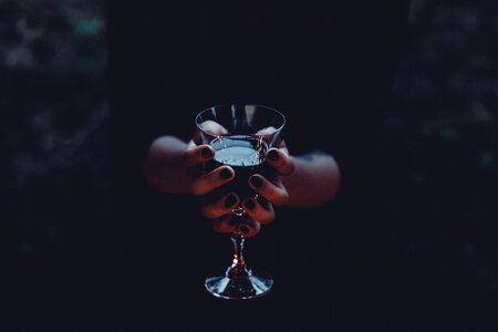 A witch holding a glass of wine 2
