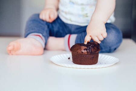Baby eating muffin 2 photo