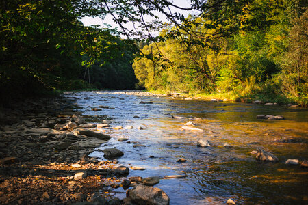 Rocky river at sunset photo
