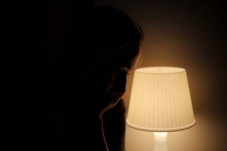 Woman in lamplight photo