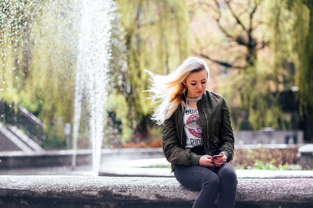 A girl at a fountain photo