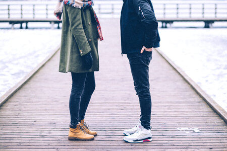 Two people standing on the pier photo