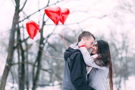 A couple with heart shape baloons 4