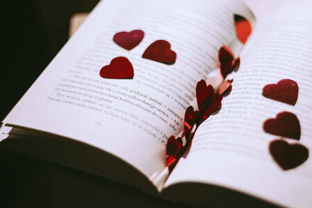 Heart confetti in an open book