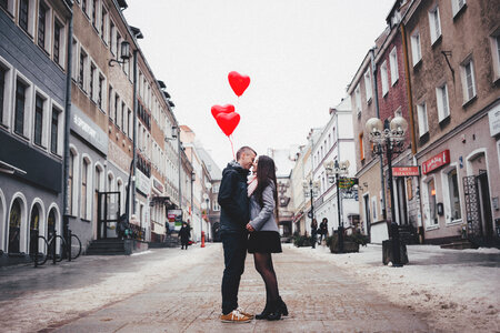 A couple with heart shape baloons 2 photo