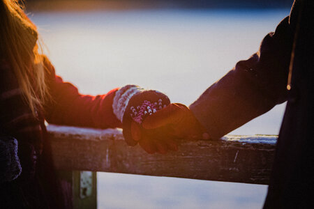 A couple holding hands in winter photo