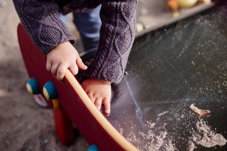 Child cleaning the slide photo