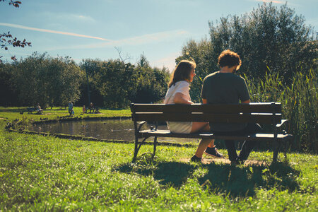 Couple sitting on a bench photo