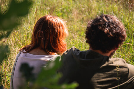 Couple sitting in the meadow 2 photo