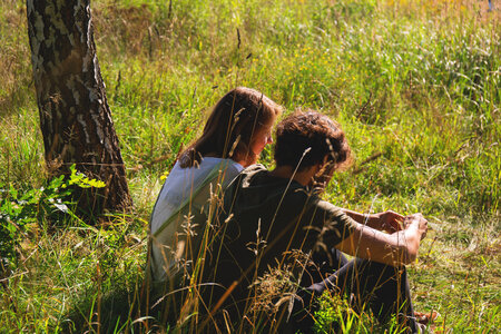 Couple sitting in the meadow photo