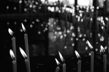 Votive candles in black and white photo