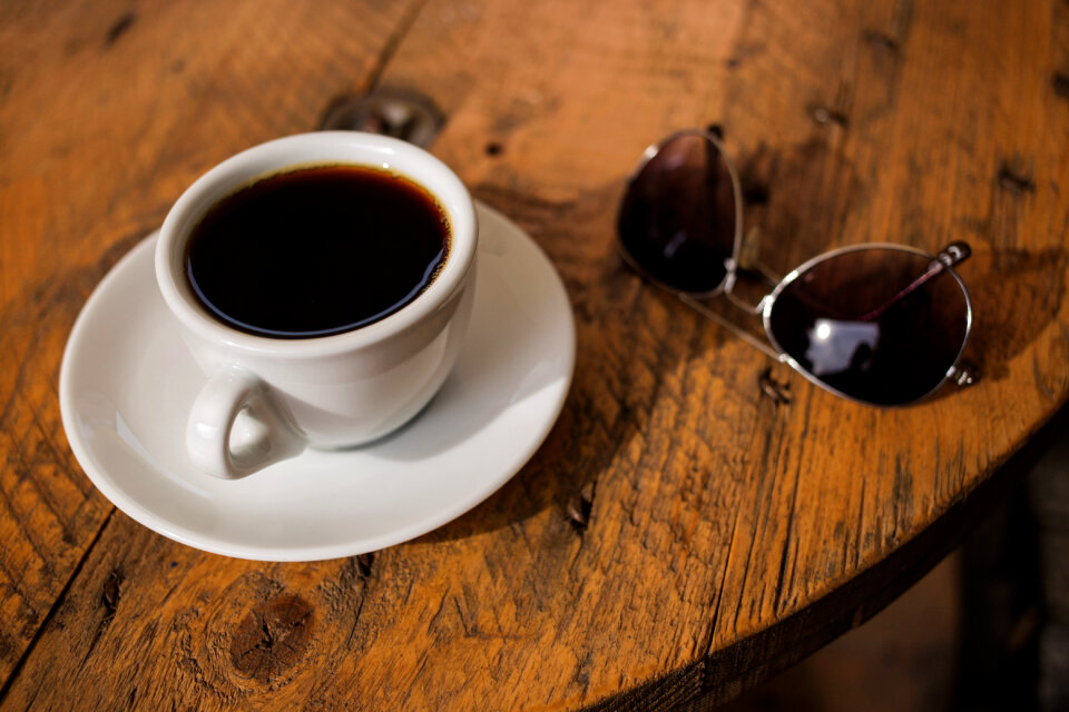 Black coffee and sunglasses photo