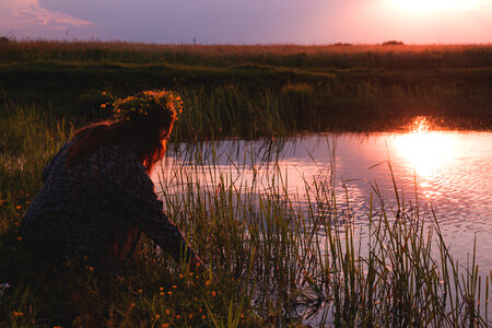 Young woman by the pond photo