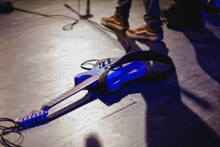 Guitar laying on the stage photo