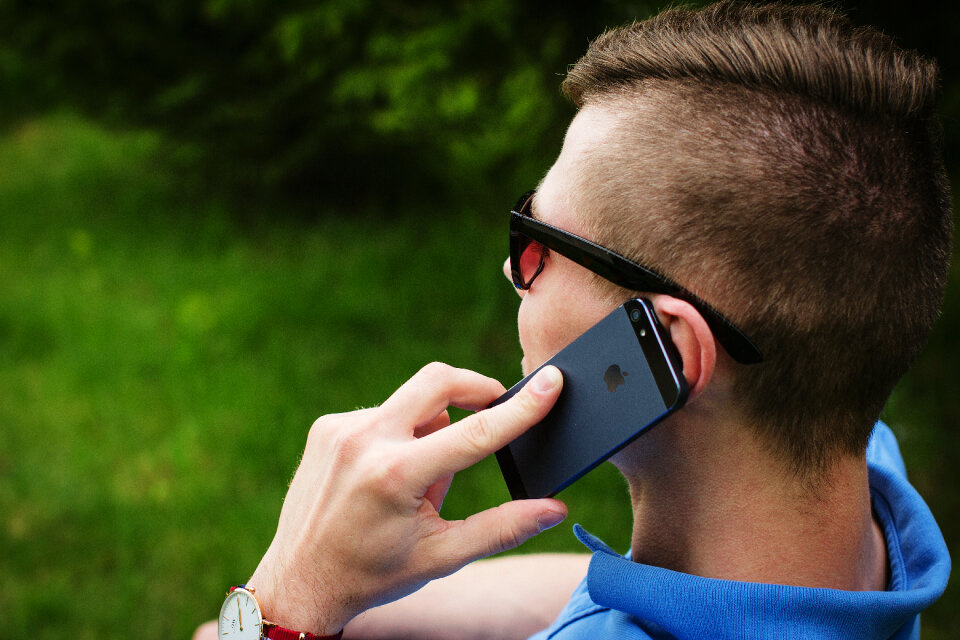 Young man talking on the phone 4