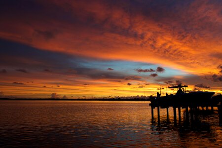 Silhouette of Wooden Dock on Sea during Golden Hour photo