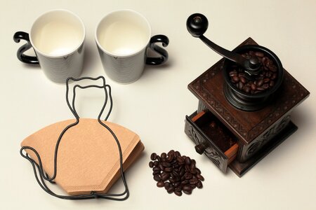 Vintage Brown Coffee Grinder on White Surface photo