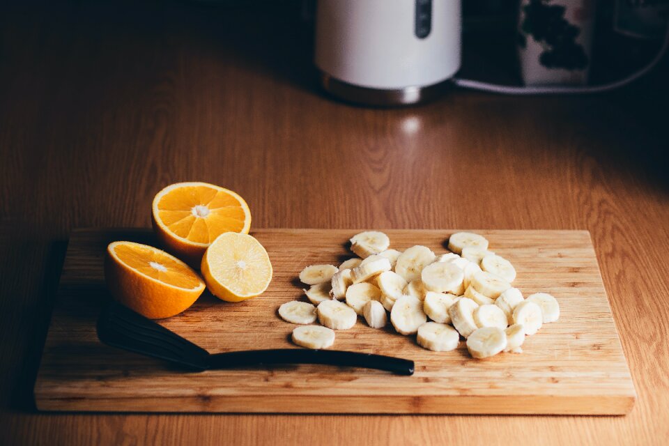 Sliced Orange Beside Black Plastic Spatula photo