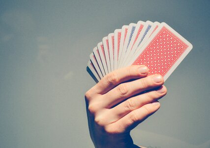 Person Holding Fan of Playing Cards photo