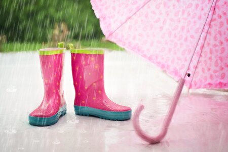 Red and Gray Rain Boots Near Pink Umbrella photo