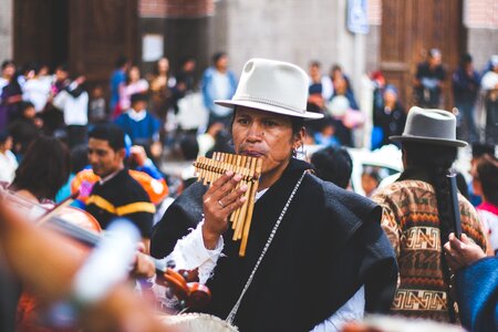 Man Playing Bamboo Wind Instrument photo