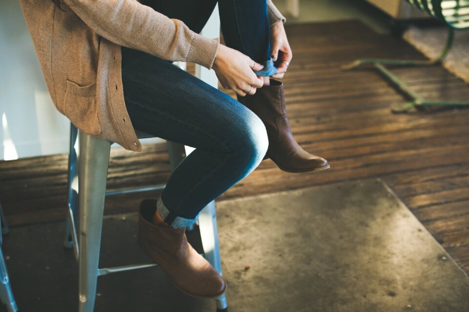 Person Sitting on Grey Stool Chair