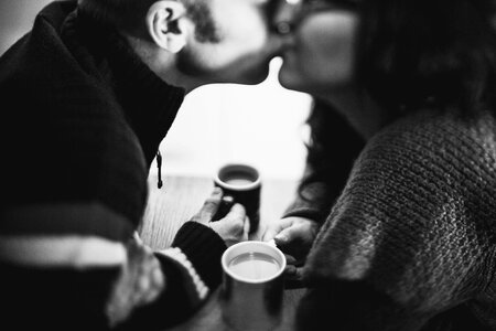 Grayscale Photo of Couple Kissing photo