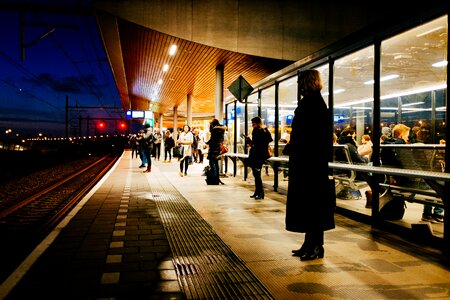 People Waiting on Train Station Platform at Night