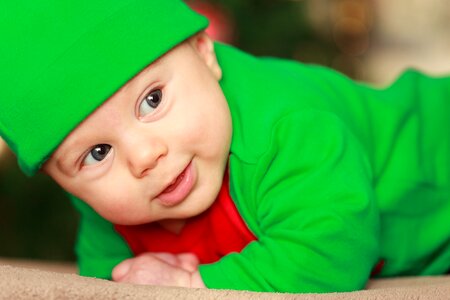 Baby Wearing Green and Red Onesie photo